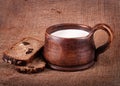 Homemade brown clay cup with milk and bread
