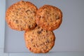 Homemade brown cookies on a grey glass background