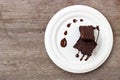 Homemade brownie served with chocolate fudge. Sweet dessert on wooden background Royalty Free Stock Photo