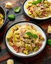 Homemade Brussels sprouts, bacon, pancetta pasta with parmesan cheese. On wooden table Royalty Free Stock Photo