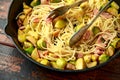 Homemade Brussels sprouts, bacon, pancetta pasta with parmesan cheese. On wooden table Royalty Free Stock Photo