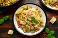 Homemade Brussels sprouts, bacon, pancetta pasta with parmesan cheese. On wooden table Royalty Free Stock Photo