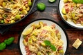 Homemade Brussels sprouts, bacon, pancetta pasta with parmesan cheese. On wooden table Royalty Free Stock Photo