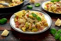 Homemade Brussels sprouts, bacon, pancetta pasta with parmesan cheese. On wooden table Royalty Free Stock Photo