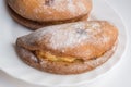 Homemade buns stuffed with cottage cheese lie on a white plate. Close up. Selective focus