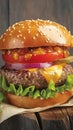 homemade burger beef, cheese, lettuce, tomato on wooden backdrop