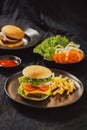 Homemade burger and cheese with fries and icy soft drink Royalty Free Stock Photo