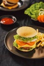 Homemade burger and cheese with fries and icy soft drink Royalty Free Stock Photo