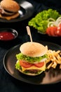 Homemade burger and cheese with fries and icy soft drink Royalty Free Stock Photo