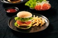 Homemade burger and cheese with fries and icy soft drink Royalty Free Stock Photo