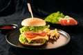 Homemade burger and cheese with fries and icy soft drink Royalty Free Stock Photo