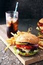 Homemade burger with fries and icy soft drink. Royalty Free Stock Photo