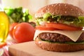 Homemade burger with ingredients on cutting board close up Royalty Free Stock Photo