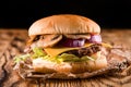 homemade burger with mushrooms in rustic style on wooden background Royalty Free Stock Photo