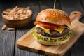 Homemade burger presented enticingly on a wooden table