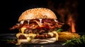 Homemade burger with two patties and melted cheese with onions and bacon on a dark background. Royalty Free Stock Photo