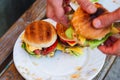 Homemade burger with white onion and tomato. Making homemade burgers