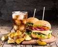 Homemade burgers with beef and fried potatoes