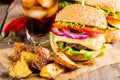 Homemade burgers with beef and fried potatoes