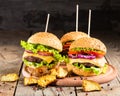 Homemade burgers with beef and fried potatoes