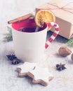 Homemade butter nuts star shaped cookies with icing, pine, orange slices,cinnamon, anise and walnuts over white wood background. Royalty Free Stock Photo