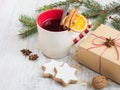 Homemade butter nuts star shaped cookies with icing, pine, orange slices,cinnamon, anise and walnuts over white wood background. Royalty Free Stock Photo