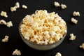 Homemade Buttered Popcorn with Salt in a Bowl on a black background, side view