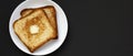 Homemade Buttered Toast on a white plate on a black background, top view. Flat lay, overhead, from above. Copy space Royalty Free Stock Photo