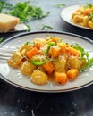 Homemade Butternut squash gnocchi with wild rocket and parmesan cheese