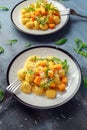 Homemade Butternut squash gnocchi with wild rocket and parmesan cheese