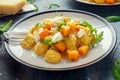 Homemade Butternut squash gnocchi with wild rocket and parmesan, ricotta cheese