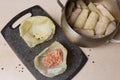Homemade cabbage rolls, minced meat in a cabbage leaf, and a pan with rolled cabbage rolls next to it Royalty Free Stock Photo