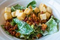 Homemade caesar salad with crispy bacon parmesan cheese and lettuce Royalty Free Stock Photo