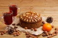 Homemade cake with almonds and two glasses with mulled wine