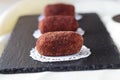 Homemade cake without baking named potato on a black tile. Selective focus. Royalty Free Stock Photo