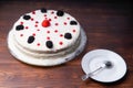 homemade cake, blackberries red currants raspberries on a wooden table. rustic Royalty Free Stock Photo