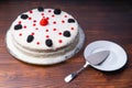 homemade cake, blackberries red currants raspberries on a wooden table. rustic Royalty Free Stock Photo