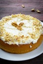 Homemade cake with butter cream and walnuts