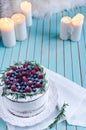 Homemade cake decorated berries on plate over wooden turquoise background Royalty Free Stock Photo