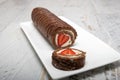 Homemade cake roll with chocolate and fresh strawberry Royalty Free Stock Photo