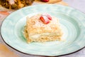 Homemade cake with vanilla custard served with fresh summer strawberries. Delicious strawberry piece of cake Napoleon Royalty Free Stock Photo