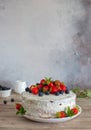 Homemade cake with whipped cream, fresh strawberries and blueberrie on top