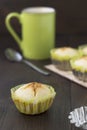 Homemade cakes-volcano on the table with green cup and spoon. Royalty Free Stock Photo