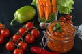 Homemade canned red sauce in a glass jar with vegetables. Side view with copy space Royalty Free Stock Photo