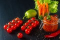 Homemade canned red sauce in a glass jar with vegetables. Side view with copy space Royalty Free Stock Photo