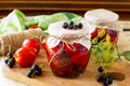 Homemade canning. Pickles tomatoes with black currant