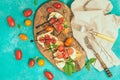 Homemade caprese bruschetta with flavorful cherry tomatoes, fresh basil, mozzarella and crispy bread Royalty Free Stock Photo