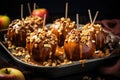 homemade caramel apples with nuts on tray Royalty Free Stock Photo