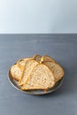 Homemade carrot bread with flax and sesame seeds on a gray background. Royalty Free Stock Photo