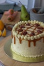 Homemade carrot cake with cream cheese frosting, caramel sauce and pecan nuts topping Royalty Free Stock Photo
